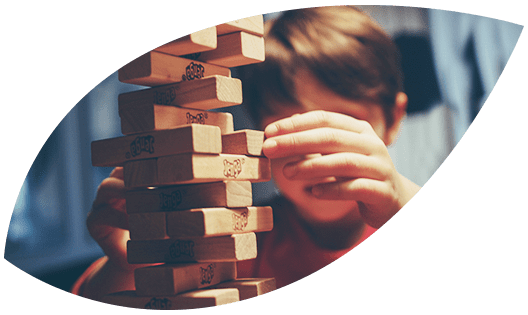 CaseRev A boy playing Jenga.