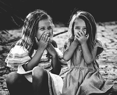 Two girls laughing