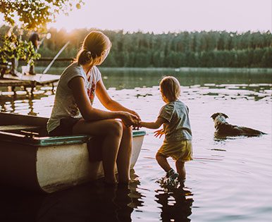 Mother with son at lake