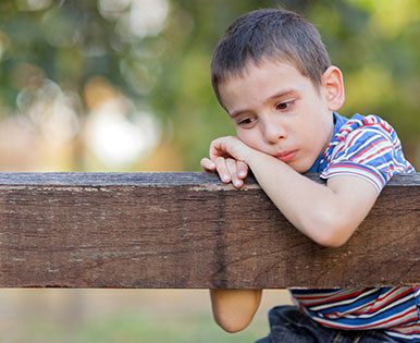 Sad Boy on park bench