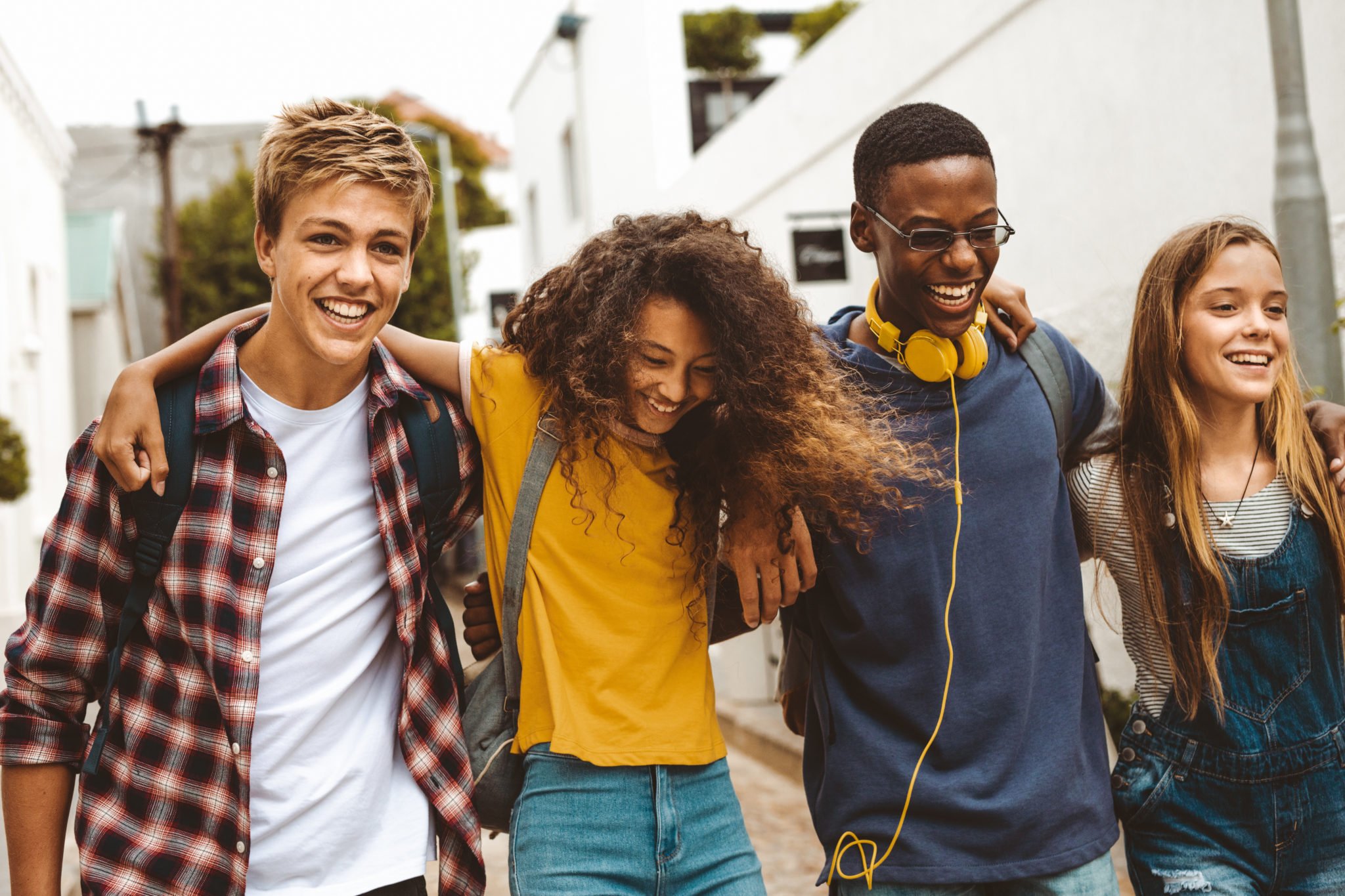 Cheerful teenage friends enjoying outdoors