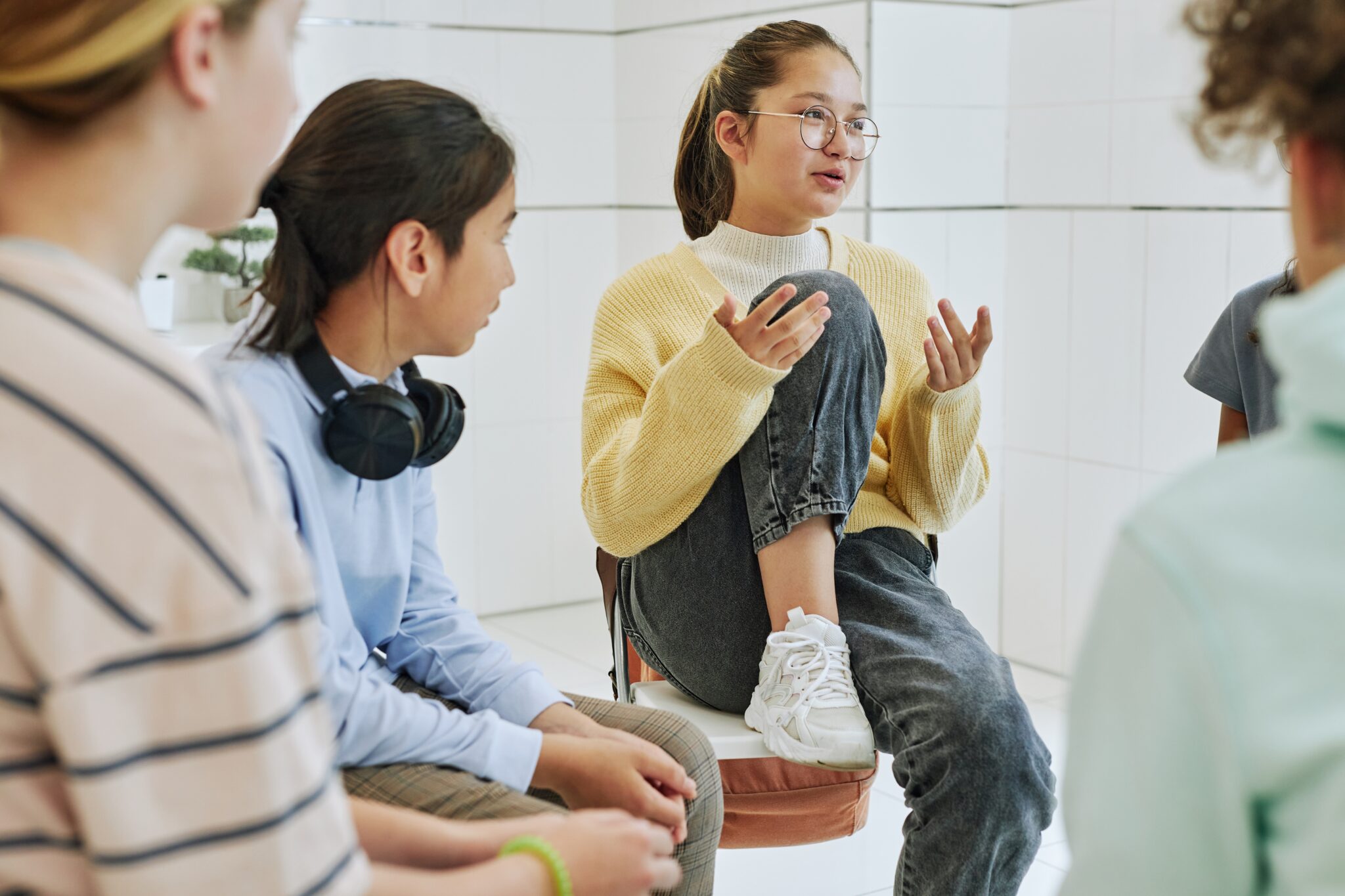 A girl sharing her story and feelings in a support group.