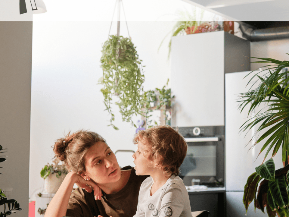 A woman talking with a child.