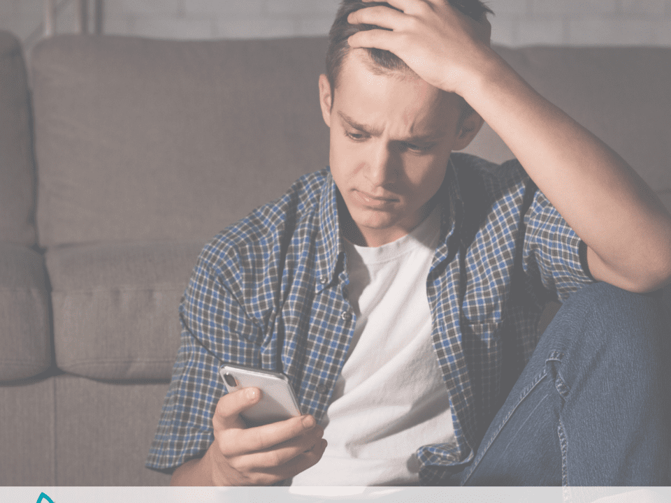 child looking frustrated at his phone.